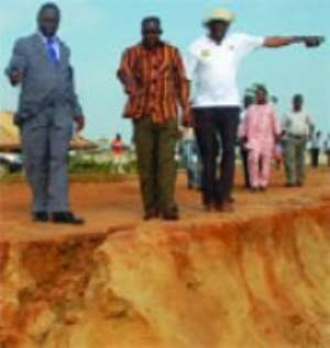 Mr Alban Bagbin 2nd left, Minister of Water Resources,Works and Housing inspecting damage caused by erosion to the coastline.