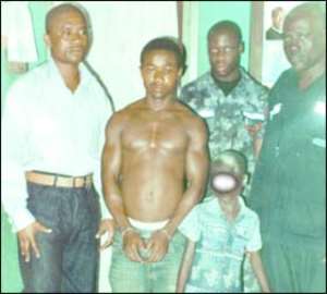 Kwesi Sampson in handcuffs and the victim, Mary Asua