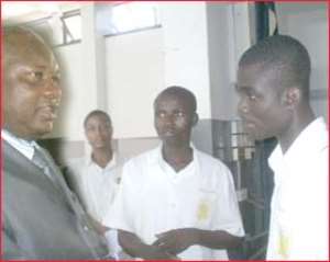 Augustine Abankwa in a chat with some students
