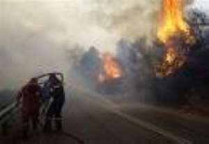 Greece faces down fire onslaught