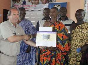 Gary Visser of Golden Star Left making a presentation to representatives of the beneficiary communities