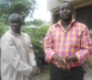 Eric Lamptey and Yussif Swallah in handcuffs