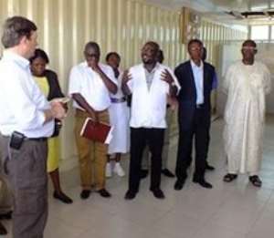 Brightson shows NMSI team and visitors a tour of Dange West hospital facilities.
