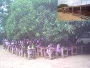 Some first year students of KETABUSCO writing their terminal examinations under a tree in the school left, INSET: The uncompleted boys' dormitory being constructed by the school's PTA