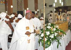 Most Rev. Vincent Boi-Nai,sprinkling and Scensing the mortal remains of Archbshop Emeritus Kodwo Andoh yesterday