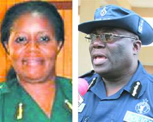 Elizabeth Adjei, Ghana Immigration Service (left), Mr. Paul Tawiah Quaye, IGP (right)