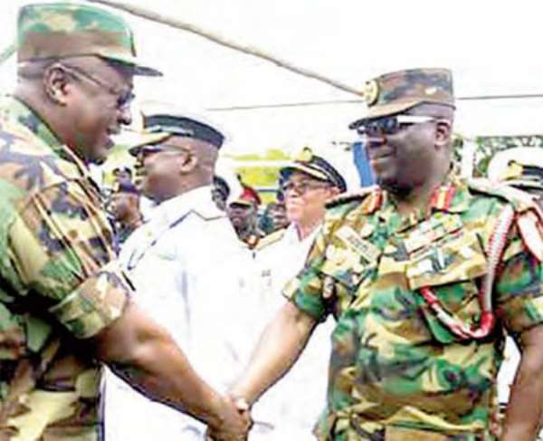 John Mahama greeting Major Gen. Sampson Adeti at Burma Camp