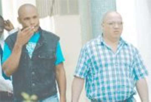 Italio Gervasio Rosero, alias Castillo (left), and Joel Meija Duarte Moises on their way to prison.