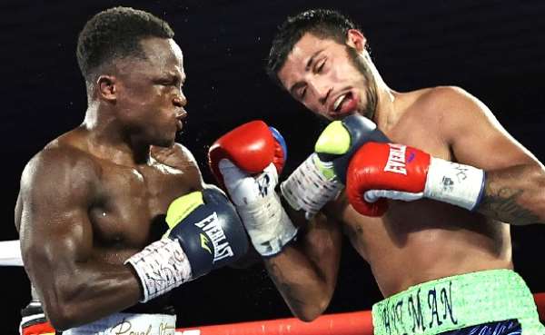 Isaac Dogboe (left) knocked out Chris Avalos in eight rounds