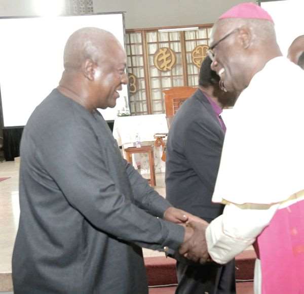 Former President John Dramani Mahama (left) exchanging pleasantries with Most Rev. John Bonaventure Kwofie, Metropolitan Archbishop of Accra at the 'Conversation in the Cathedral' held at the Holy Spirit Cathedral in Accra