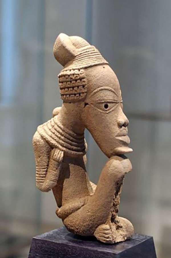 Figure of a seated male. One of the looted Nigerian Nok terracotta bought by the French, now in the possession of the Musée du Quai Branly, Paris, France, with a dubious post factum consent of the Nigerian government.