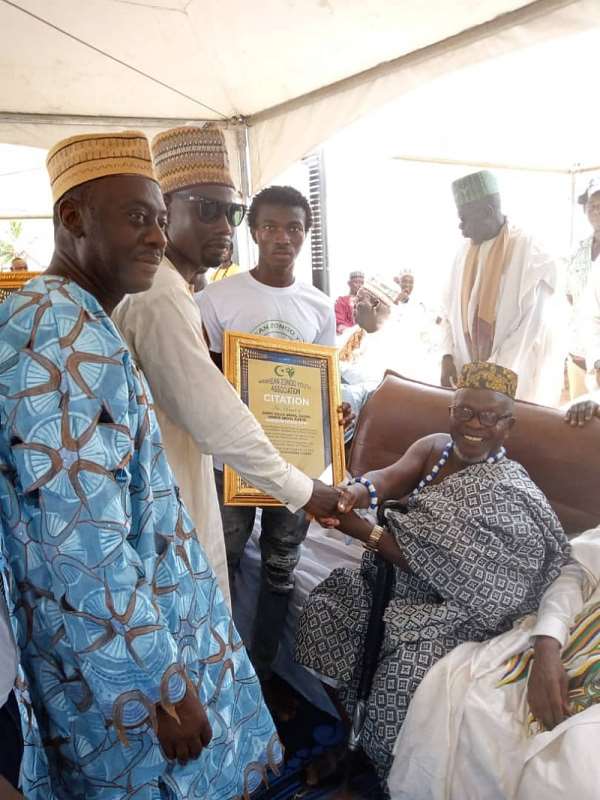 The Chief seated (right) receiving one of the citations.