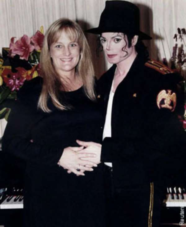 NOW $CRAM! Jacko s mom, Katherine allegedly agreed to pay his ex Debbie Rowe to avert a potential battle over their two kids.