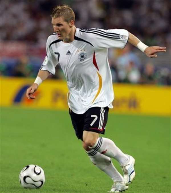 Germany's Bastian Schweinsteiger controls the ball during the World Cup 3rd place soccer match between Germany and Portugal at the Gottlieb-Daimler st