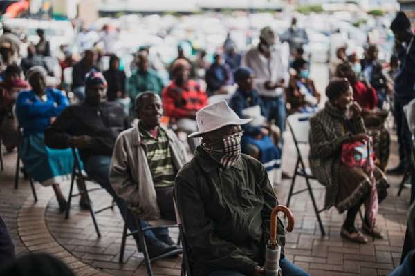 An elderly man at a social grant paypoint in South Africa after the COVID-19 lockdown. (Photo by MARCO LONGARI / AFP) () - Source: Photo by Marco Longari/AFP via Getty Images