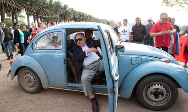 José Mujica in his Volkswagen Beetle. Photo credit: Natacha Pisarenko/AP