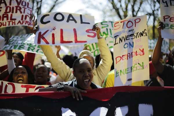 Demonstrators in Johannesburg march against environmental damage done by coal. - Source: Photo by Cornell Tukiri/Anadolu Agency/Getty Images