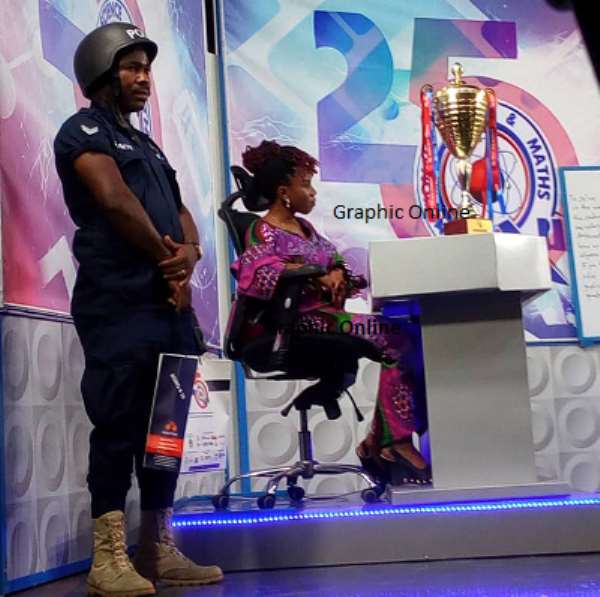 NSMQ: Police Officers Protect Quiz Mistress’ Handbag