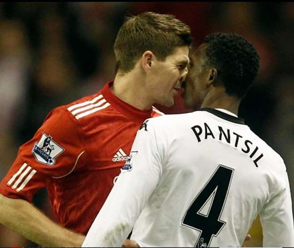 Flashback: Liverpool legend Steven Gerrard (left) in a head-butt tussle with Fulham's John Paintsil