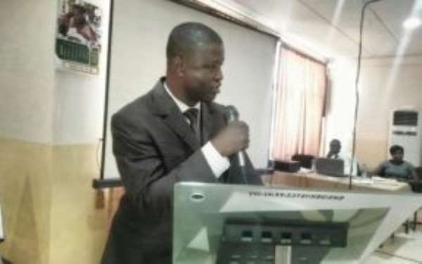The UE Regional Director of the National Health Insurance Authority, Mr Sebastian Alagpulinsa , addressing stakeholders on UHC