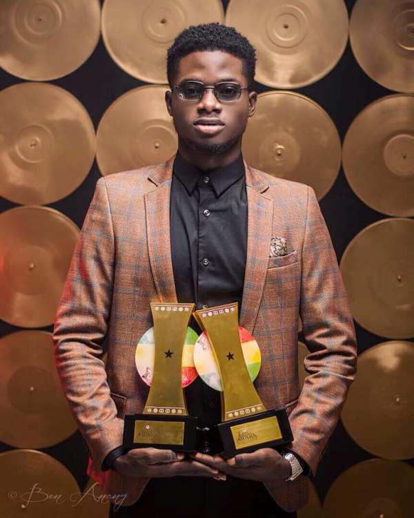 Kuami Eugene aka Rockstar showcases his awards after the 2020 VGMA