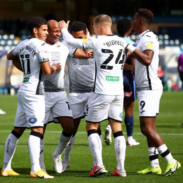 Andre Ayew celebrates with Swansea City teammates
