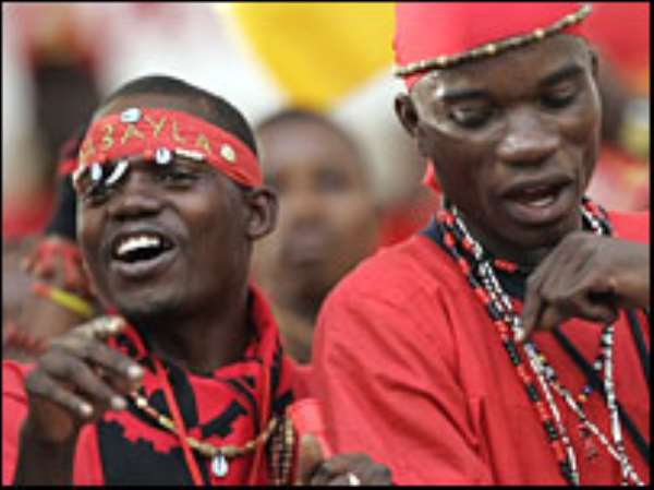 Angola fans celebrate their first appearance in the last eight