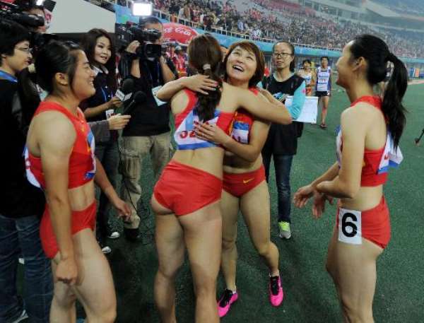 Members of the Chinese women's team celebrate after winning the 4x100m Relay Final during the East Asian Games in Tianjin on October 9, 2013. By Mark Ralston (AFP)