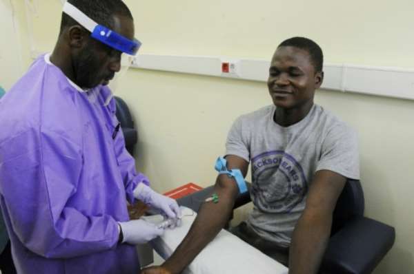 An Ebola survivor who volunteered to participate in a study in Monrovia on June 18, 2015, after Liberia launched a five-year study to unravel the mystery of the long-term health effects that plague Ebola survivors. By Zoom Dosso (AFP/File)