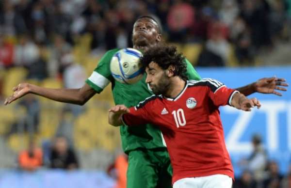 Egypt's Mohamed Saleh (front) and Nigeria's Stanley Amuzie fight for the ball during their African Cup of Nations qualification match, at the Borg el-Arab Stadium in Alexandria, in March 2016. By Khaled Desouki (AFP/File)