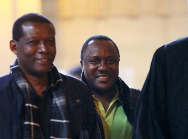 Claude Muhayimana (C), one of the two Rwandan men accused of taking part in the massacre of ethnic Tutsis during the Rwandan genocide, arrives for an extradition hearing at the courthouse in Paris, on November 13, 2013. By Marion Ruszniewski (AFP/File)