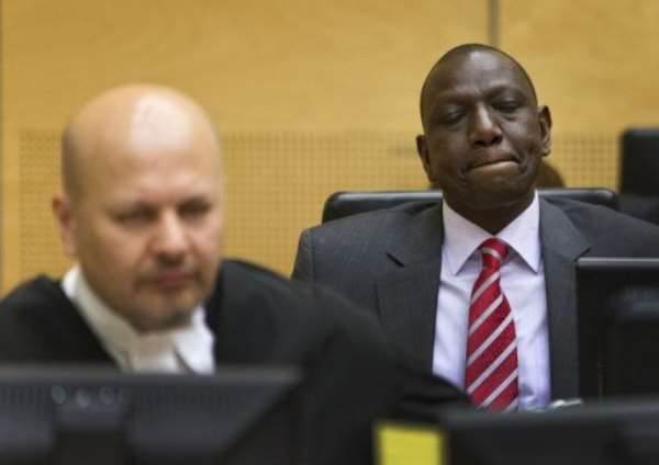 William Ruto (right) sits in the courtroom before their trial at the (ICC) in The Hague on September 10, 2013.. By Michael Kooren (Pool/AFP/File)