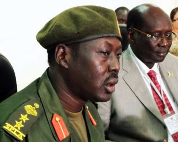 SPLA spokesman Colonel Philip Aguer (L) and South Sudan government spokesman Barnaba Marial Benjamin. By Waakhe Wudy (AFP)