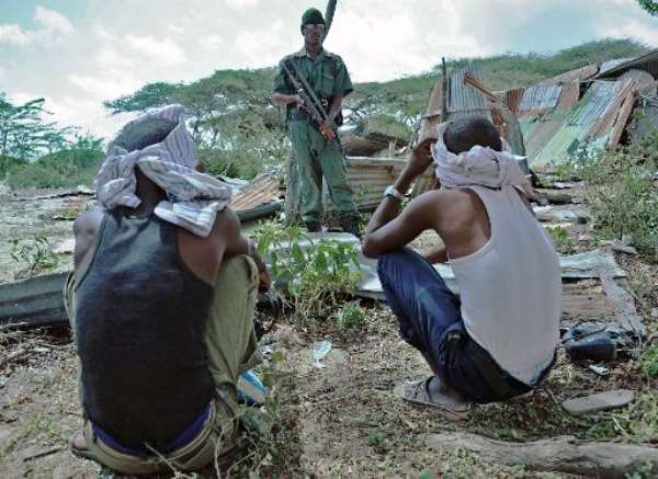 Suspected Al-Shebab members are detained by Somali security forces during an operation in Mogadishu on December 8, 2014. By Mohamed Abdiwahab (AFP/File)