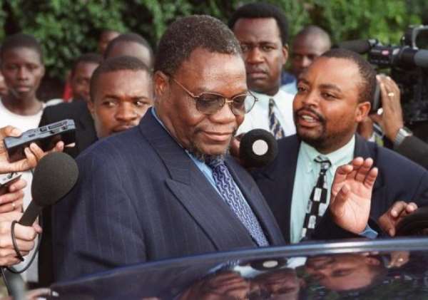 Zimbabwe's then Minister of Land and Agriculture Kumbirai Kangai leaves Harare Magistrates Court March 21, 2000. By (AFP/File)