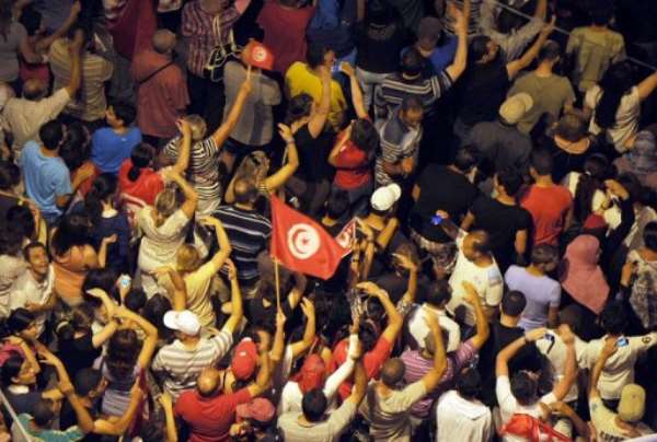 Tunisian protesters gather in front of the Constituent Assembly headquarters in Tunis on August 4, 2013. By Fethi Belaid (AFP/File)