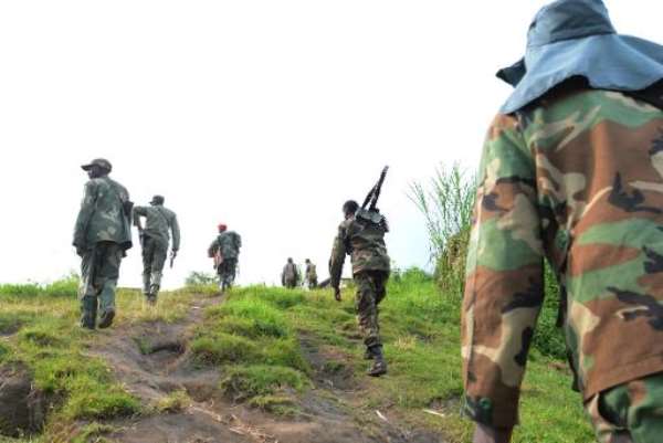 M23 rebel group fighters walk on June 3, 2013 in Mutaho toward the frontline to fight troops from the Democratic Republic of Congo Armed Forces. By Junior D. Kannah (AFP/File)