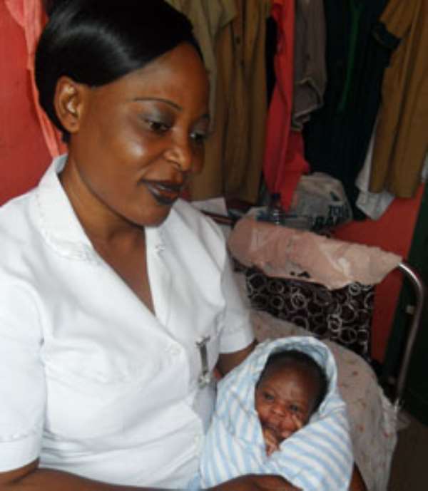 Little Derrick Nyamekye Donko with Ms. Odette Anaba