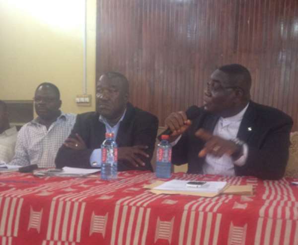 Ato Conduah (right) explaining a point while Seth A. Amoani looks on