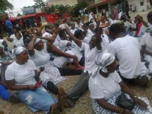Some of the FENPG members praying fervently at the Central Post Office at Adum on Monday.