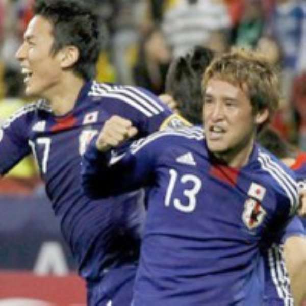 Japan players celebrate after the qualification