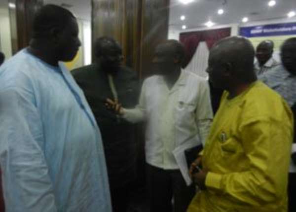 Seth Terkper (middle) interacting with some stakeholders at the EDAIF review meeting