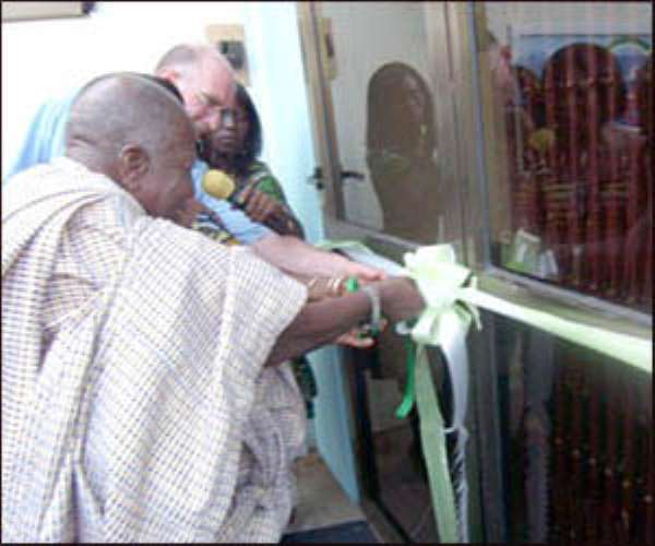 Nifahene cutting the tape to officially open the studios