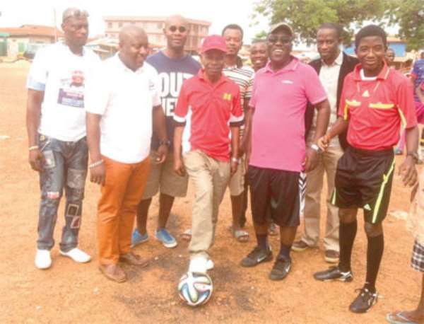 Ayisi Boateng kicking the ball to start the gala as Sir John, Nana B and others look on