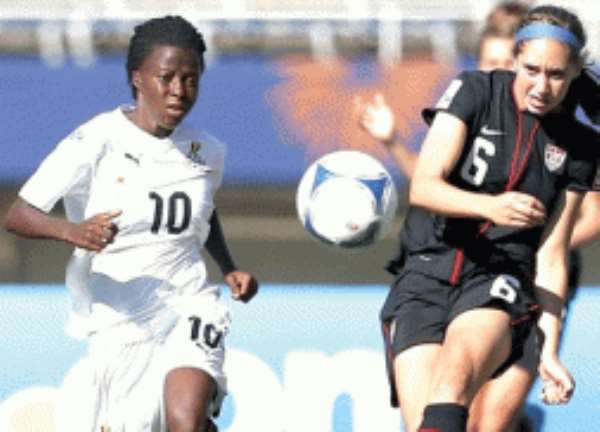 Sarah Killion (right) of the US and Ghana's Priscilla Saahene in pursuit of the ball.