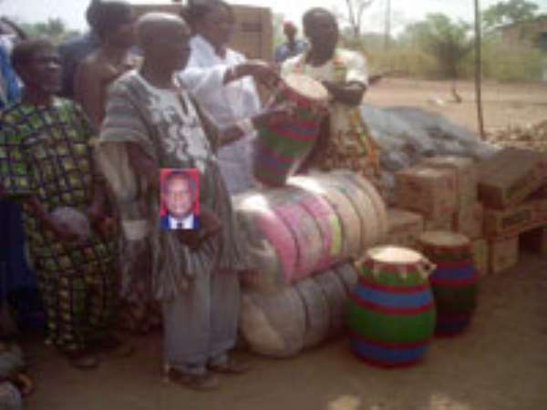 The Deputy Minister for Transport, Mrs. Dzifa Ativor, presenting the items to Mr. Anthony Adzavor (right) representing the cured lepers