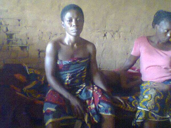 Mrs Sarah Isaiah being consoled by neigbhor hours after the kidnapping