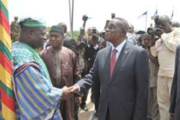 Majority Leader Cletus Avoka (left), congratulating President Mills after the address