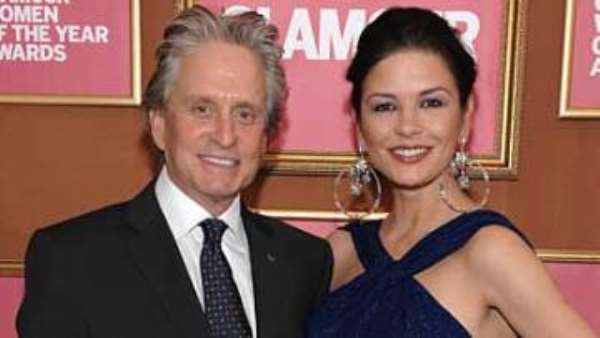 Catherine Zeta Jones with husband Michael Douglas who is battling throat cancer