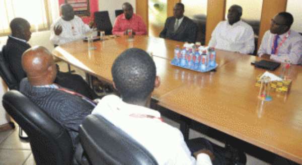Mr Kenneth Ashigbey (hand raised) Managing Director of the Graphic Communications Group Limited in a discussion with a delegation of the Ghana Printers and Converters Association, which called on him in Accra.